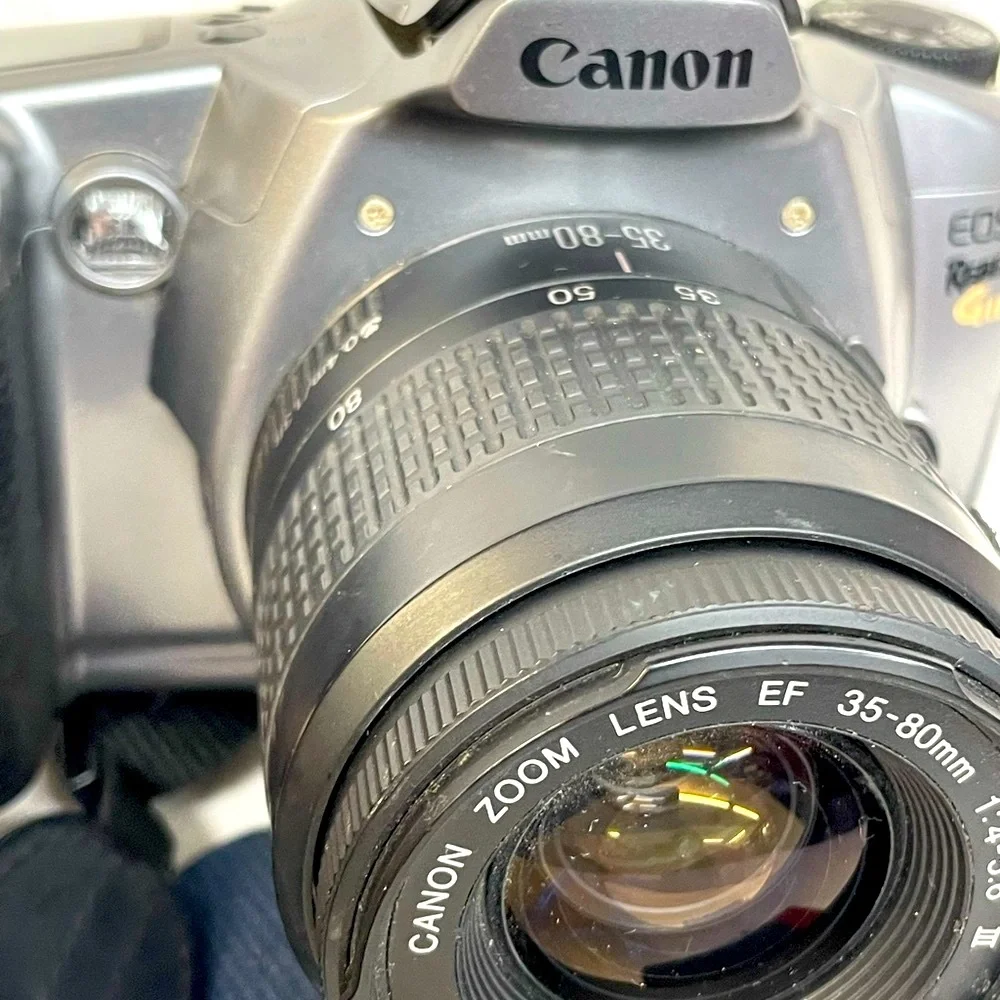 Canon EOS Rebel GII 35mm SLR Camera - Silver & Black with shoulder strap